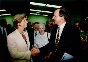 Bill Dressel shaking hands with Governor Whitman