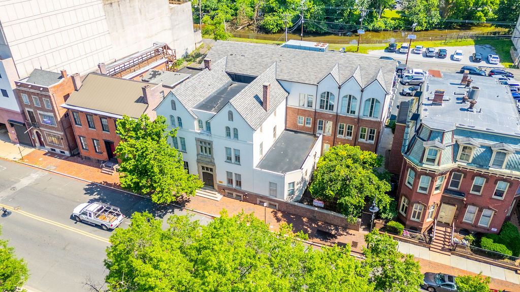 Exterior front view of a white 3 story building